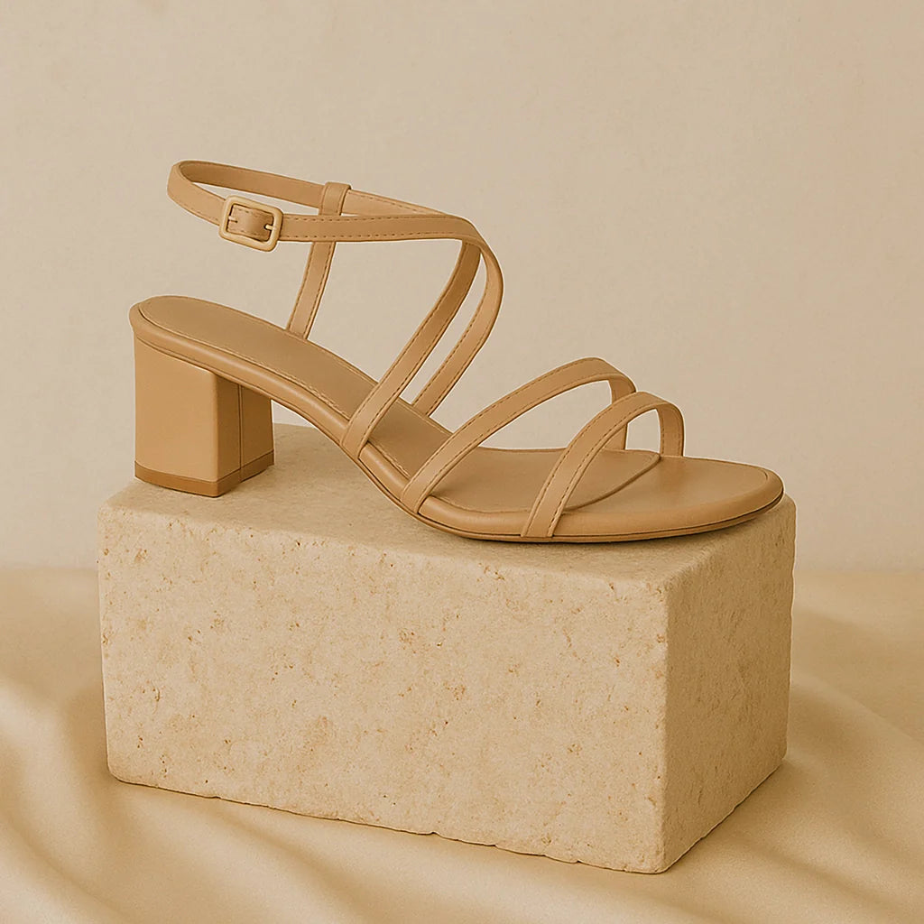 “GlamoROZ Sandals & Slides collection featuring minimalist beige sandals and slides crafted in soft leather displayed on a neutral fabric background.”