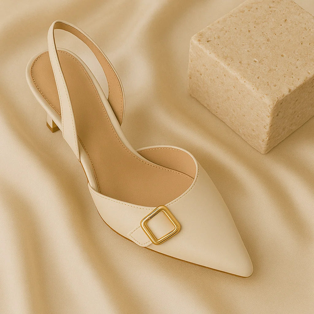 “GlamoROZ Heels collection featuring beige pointed-toe pumps and elegant high heels displayed on neutral satin fabric background.”