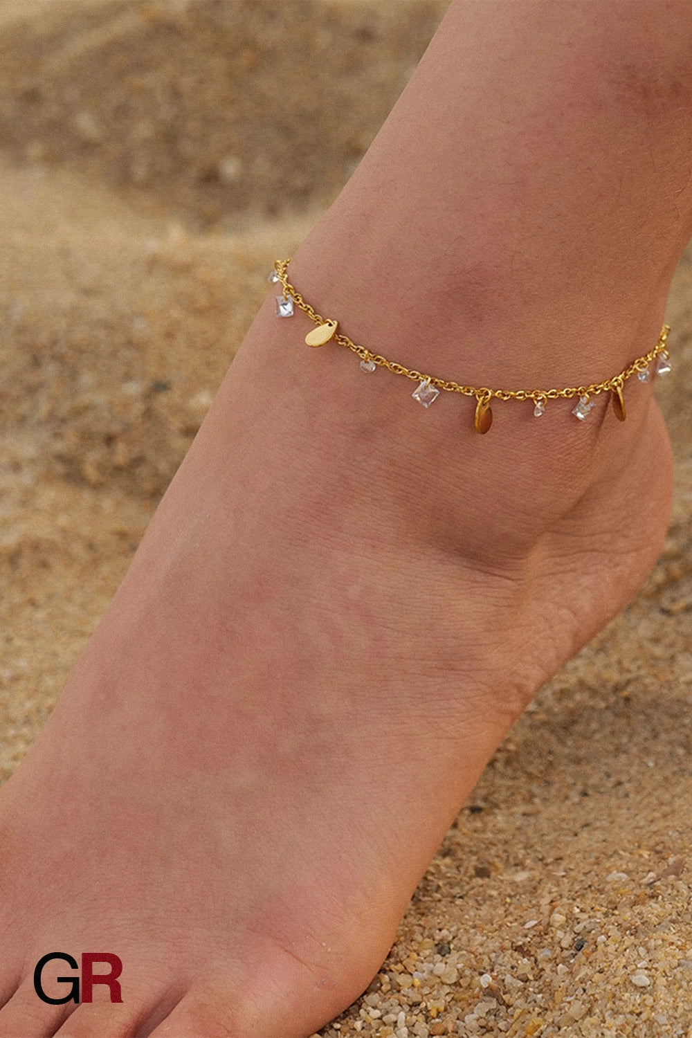 “GlamoROZ Éclat Doré Luminous Tassel Anklet front view on neutral background”