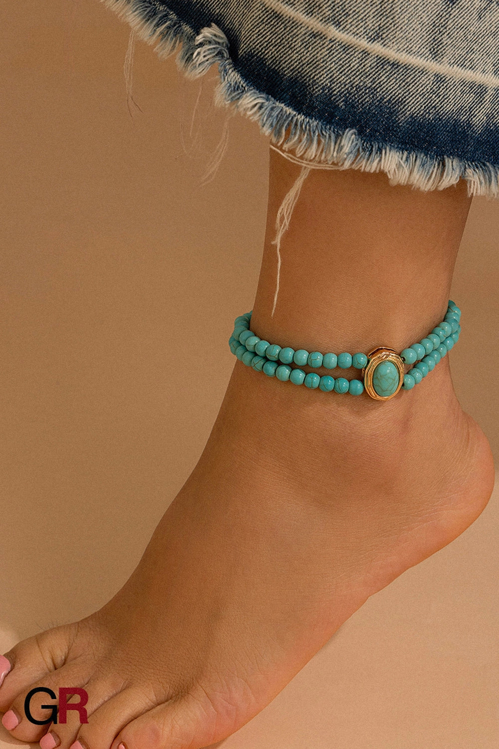 “GlamoROZ Baroque Grace Double-Pearl Anklet wrist/ankle styled on model with cropped denim”