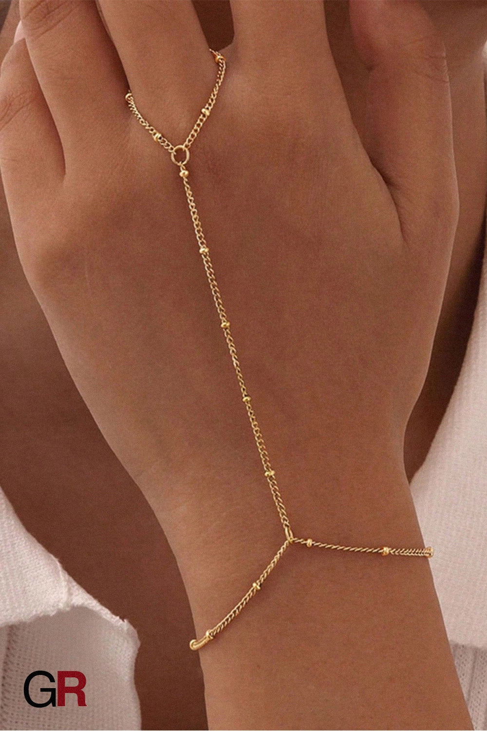 “GlamoROZ Voile Dore Luminous Gold Beaded Hand Chain Jewelry clasp and connector detail close-up”