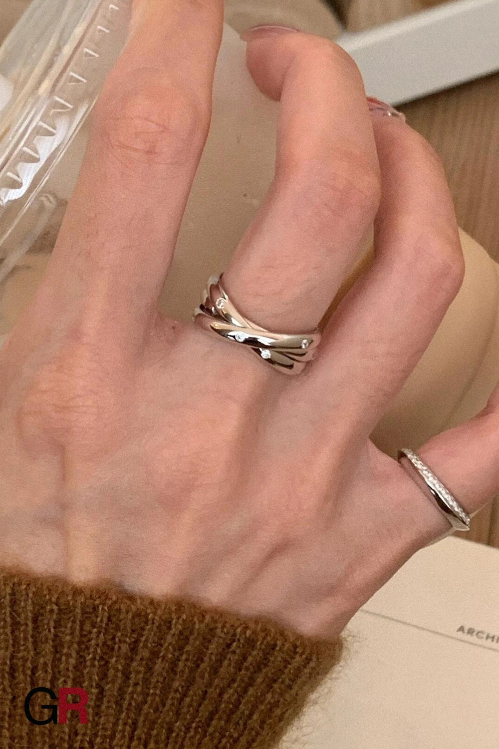 “GlamoROZ Éclat Entrelacé Silver Multi-Layer Trinity Ring Jewelry macro shot highlighting layered band texture”