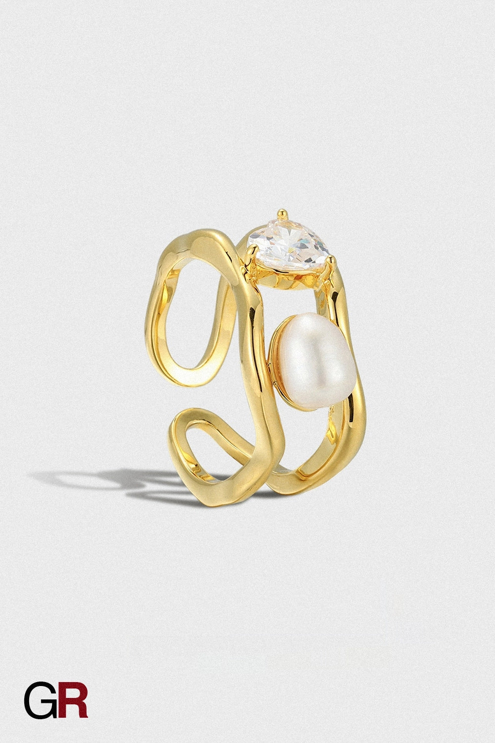 “GlamoROZ Lune Dore Gold & Pearl Ring Jewelry styled on model hand with elegant outfit”