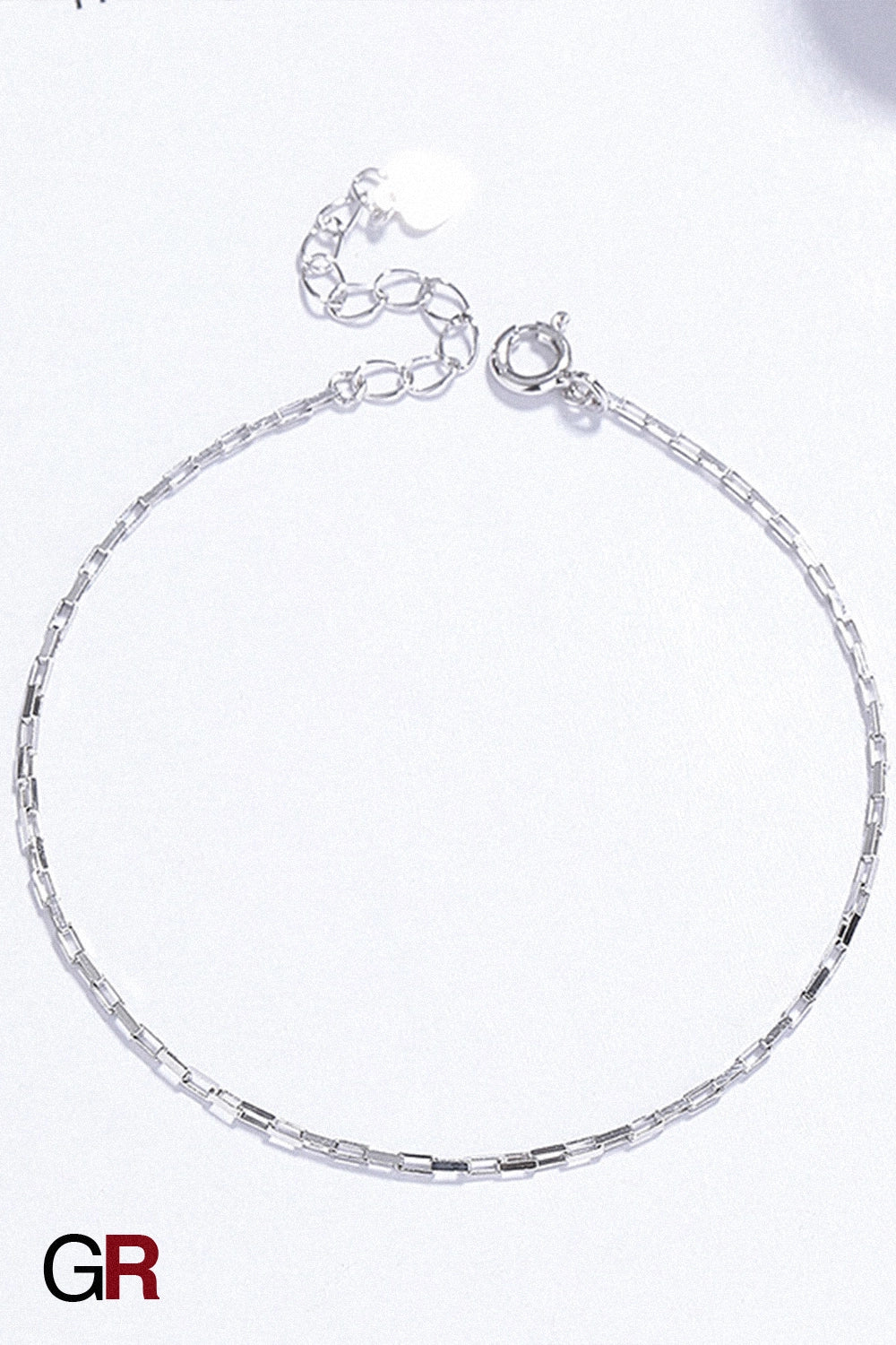 “GlamoROZ Argent Whisper Luminous Silver Cuff Bracelet Jewelry styled on model wrist with elegant outfit”