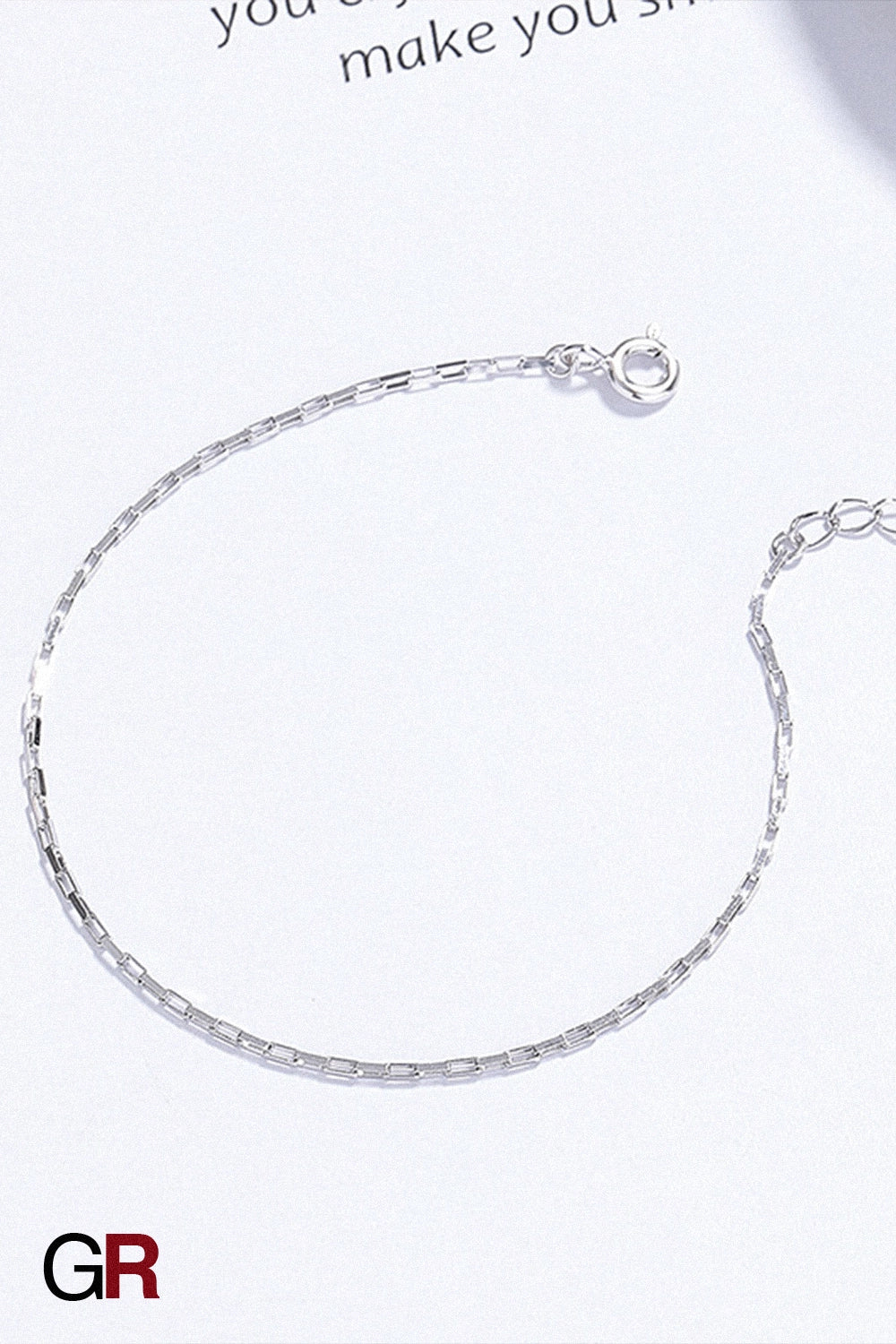 “GlamoROZ Argent Whisper Luminous Silver Cuff Bracelet Jewelry flat-lay on soft beige fabric background”