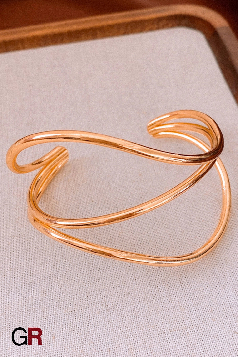 “GlamoROZ Flux Doré Luminous Gold Open Cuff Jewelry front view on neutral background”