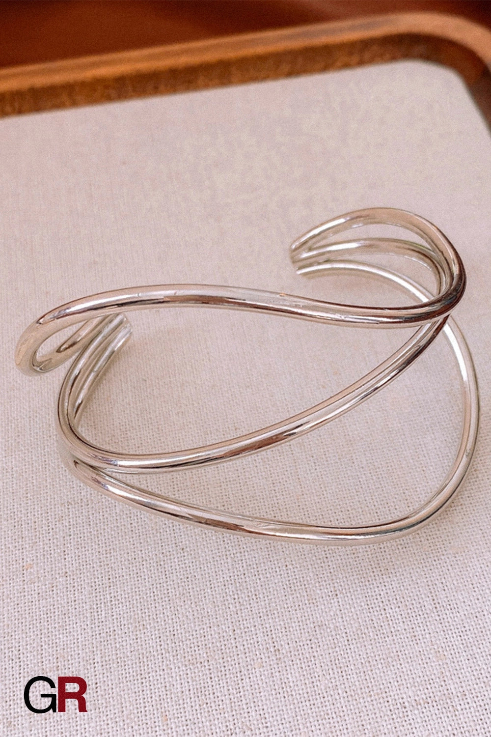 “GlamoROZ Flux Doré Luminous Gold Open Cuff Jewelry close-up showing geometric gold line detail”