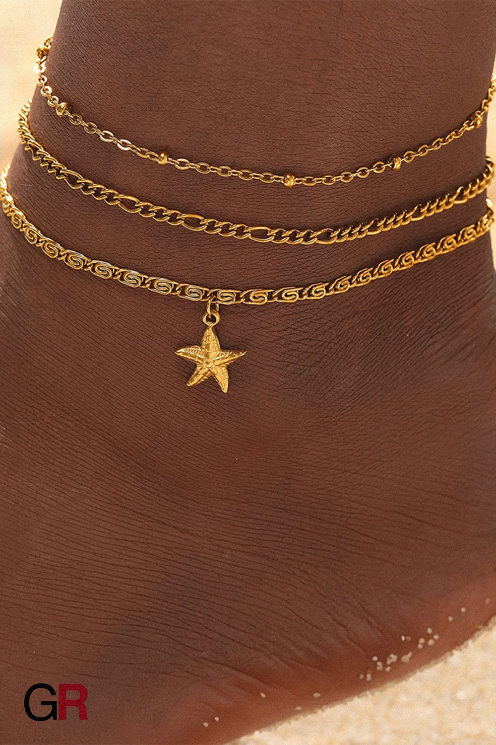 “GlamoROZ Golden Mare Layered Star Anklet starfish charm detail on ankle”