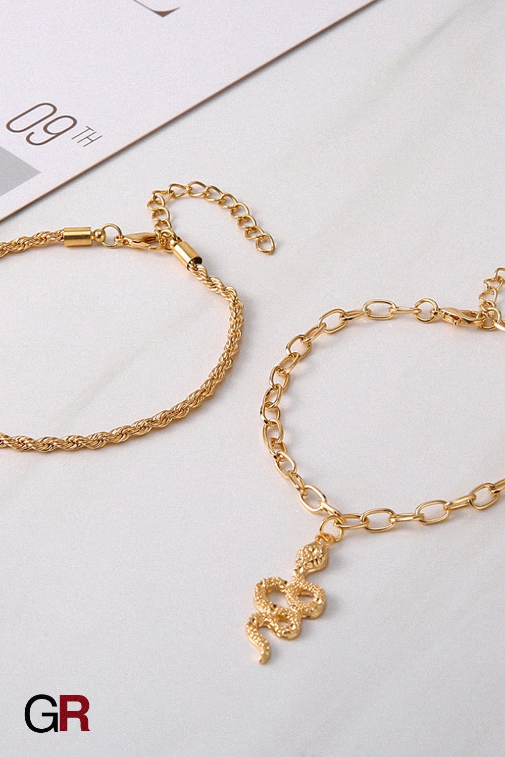 “GlamoROZ Serpentine Divine Luminous Gold Circle Anklet Jewelry styled on model ankle with sandals”