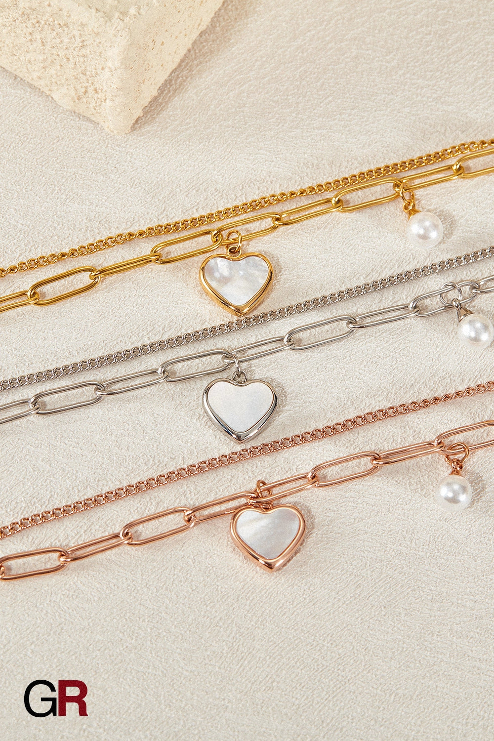 “GlamoROZ Lune Amour Luminous Gold Beaded Bracelet Jewelry close-up of gold heart charm and beads”