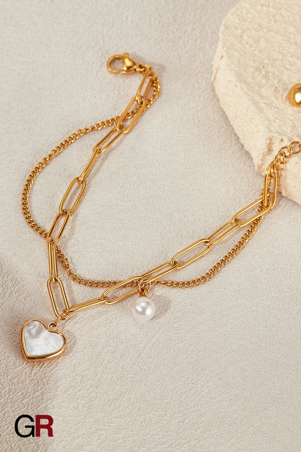 “GlamoROZ Lune Amour Luminous Gold Beaded Bracelet Jewelry detailed macro shot showing pearl and heart charm reflections”