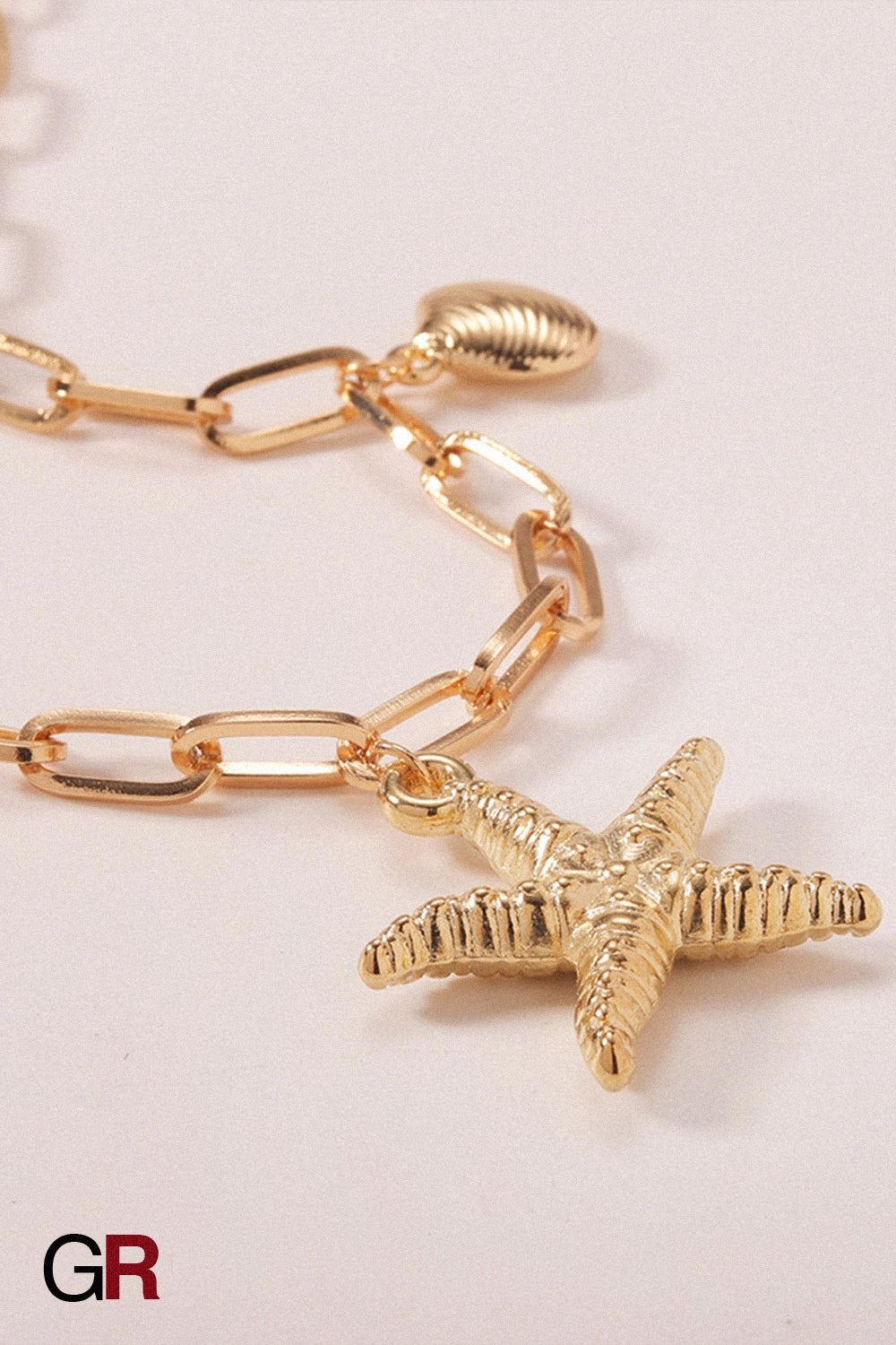 “GlamoROZ Étoile Marine Luminous Starfish Gold Anklet Jewelry gold chain and clasp detail close-up”