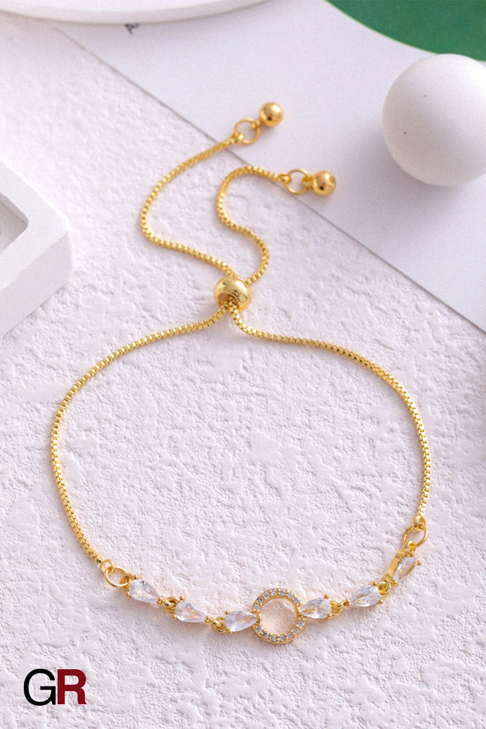 “GlamoROZ Lune Éclat Luminous Silver Circle Bracelet Jewelry flat-lay on soft beige fabric background”