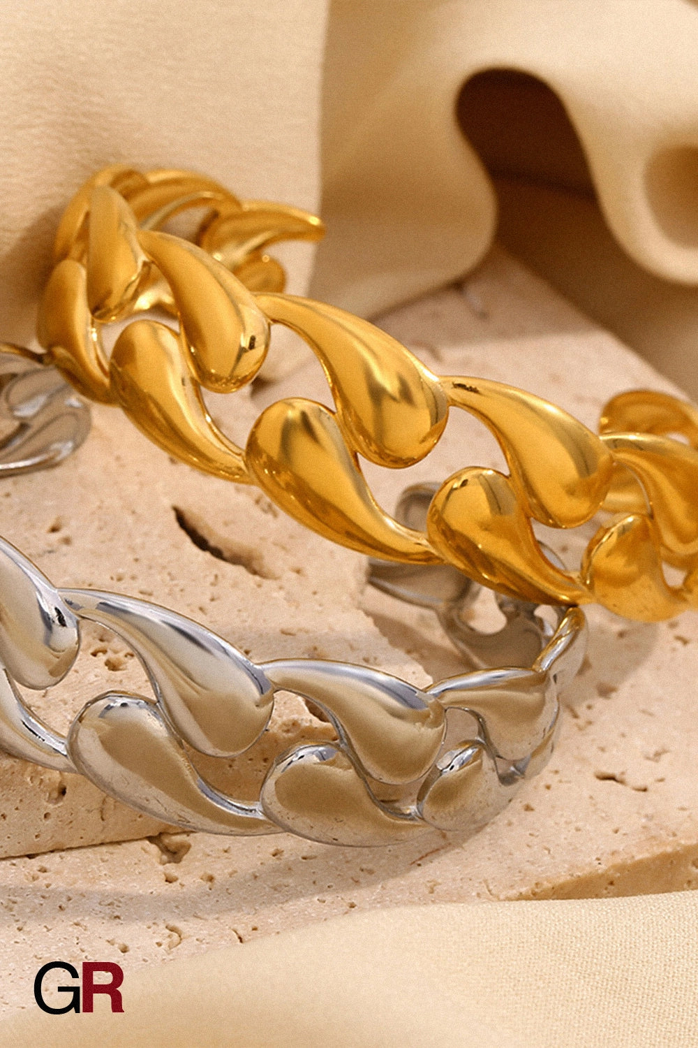 “GlamoROZ Volute Dorée Luminous Gold Curve Cuff Jewelry front view on neutral background”