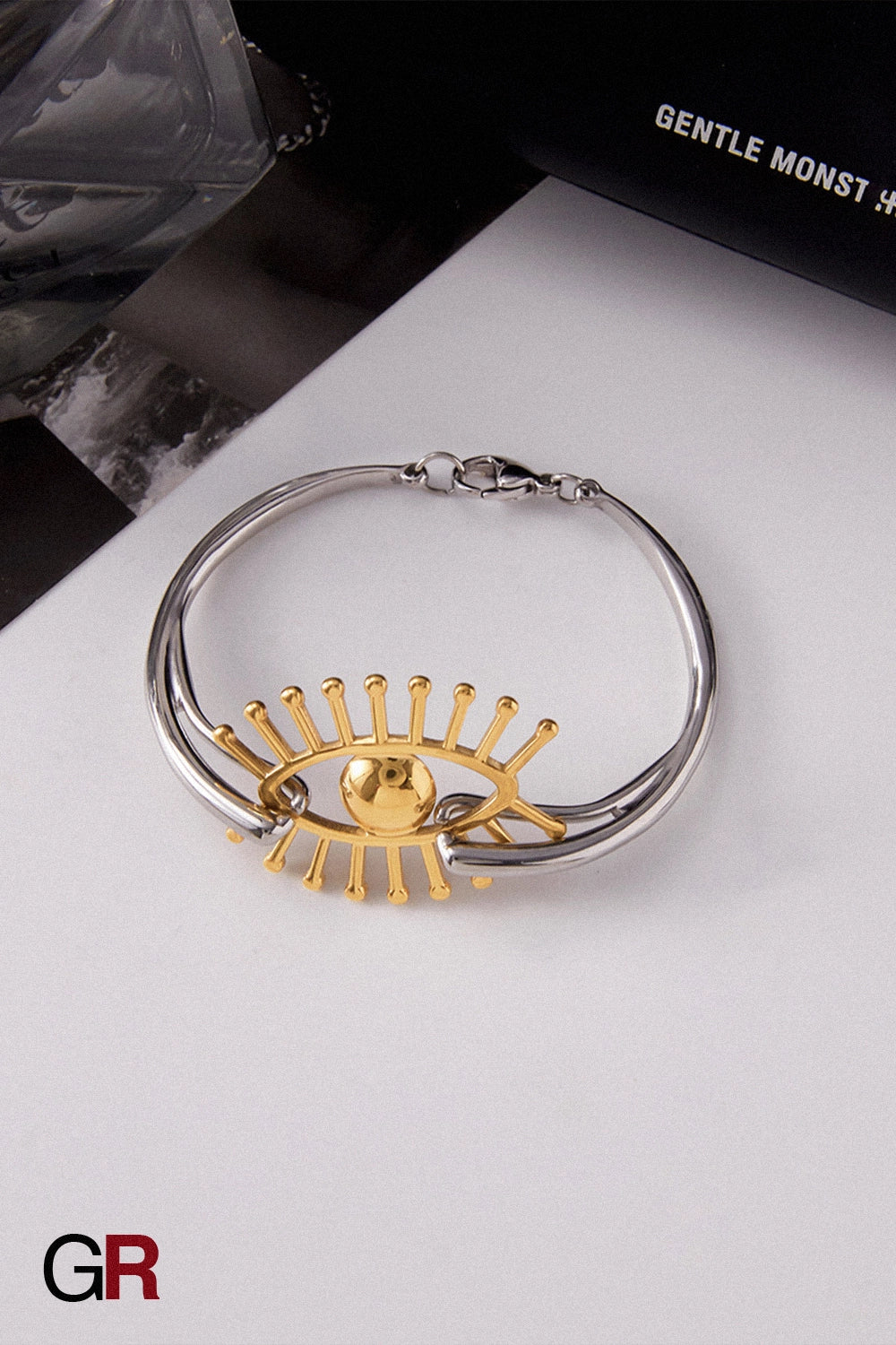 “GlamoROZ Flux Dual Luminous Silver & Gold Eye Cuff Jewelry styled on model wrist with elegant outfit”