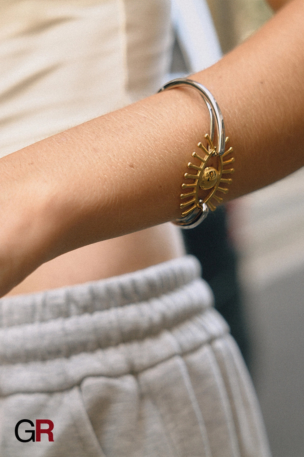 “GlamoROZ Flux Dual Luminous Silver & Gold Eye Cuff Jewelry silver band and gold eye motif detail close-up”