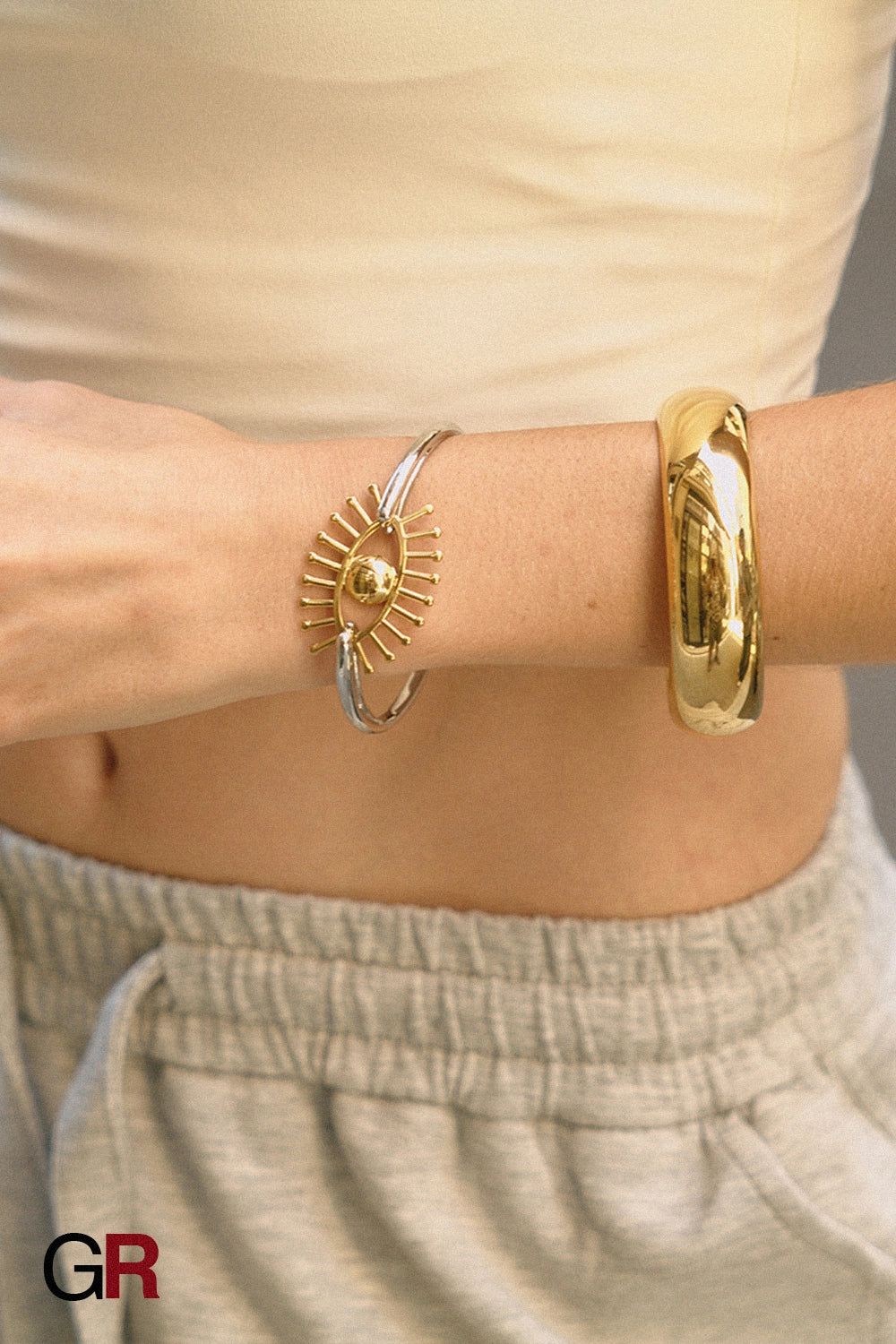“GlamoROZ Flux Dual Luminous Silver & Gold Eye Cuff Jewelry front view on neutral background”