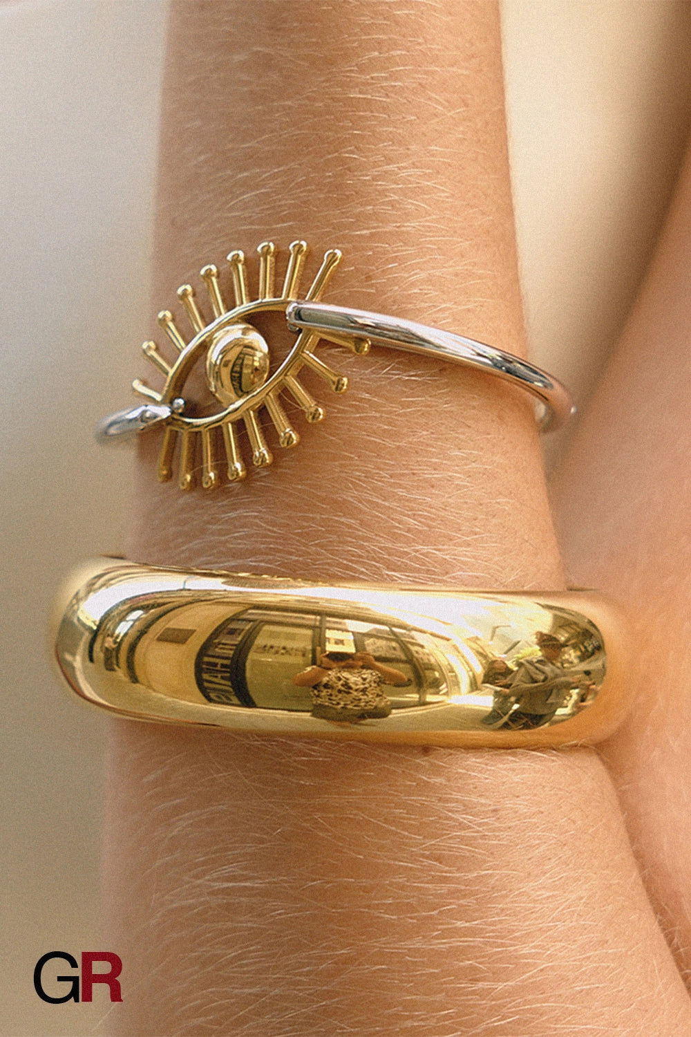 “GlamoROZ Flux Dual Luminous Silver & Gold Eye Cuff Jewelry macro shot highlighting contrast of gold and silver tones”