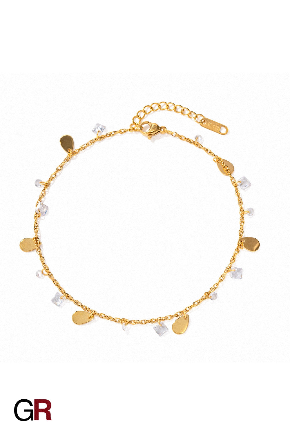 “GlamoROZ Éclat Doré Luminous Tassel Anklet styled on model ankle with soft lighting”