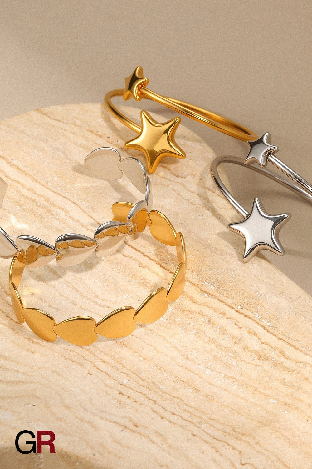 “GlamoROZ Astre Divin Luminous Gold Charm Bangle Jewelry close-up of star and heart charms”