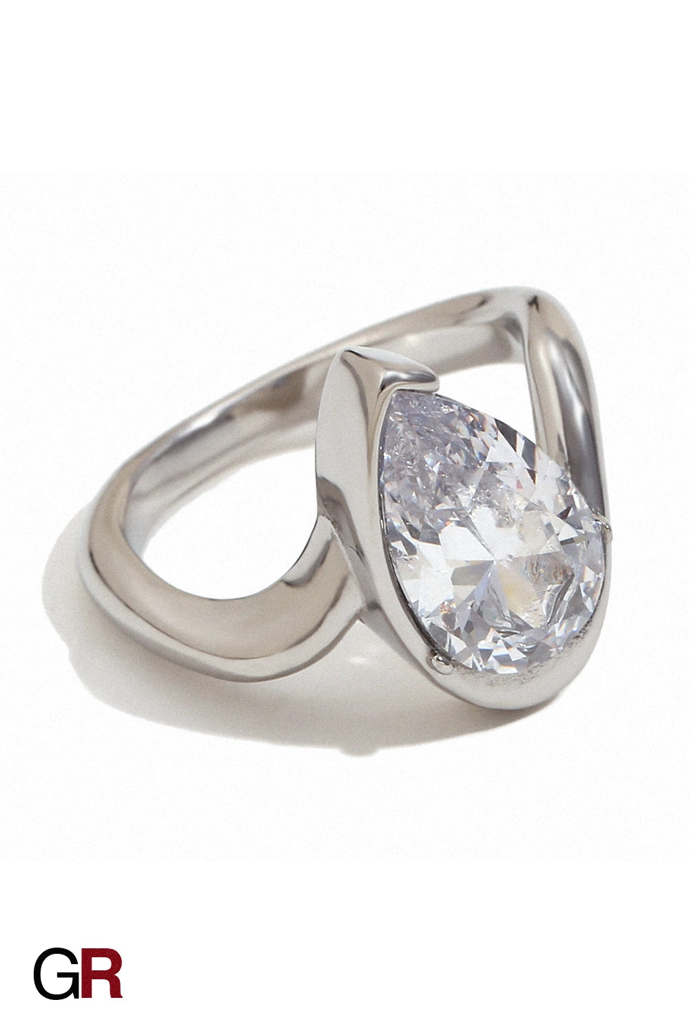 “GlamoROZ Aureole Doré Teardrop Open Band Ring Jewelry styled on model hand with elegant outfit”