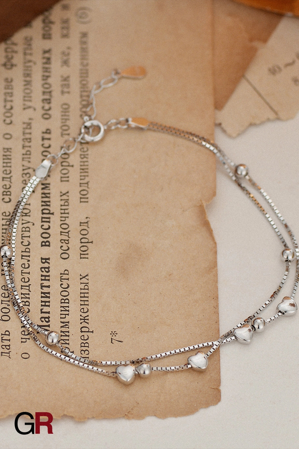 “GlamoROZ Luna Cœur Luminous Gold Beaded Bracelet Jewelry close-up of gold beads and heart accents”