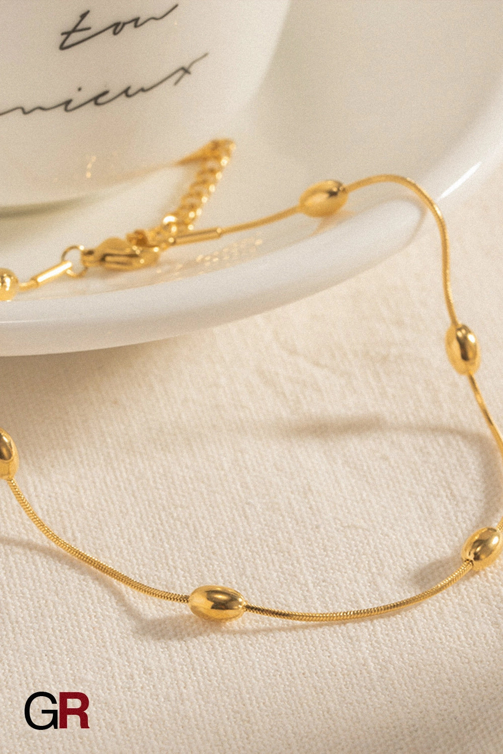 “GlamoROZ Aurora Sol Luminous Beaded Anklet adjustable clasp and bead pattern detail”