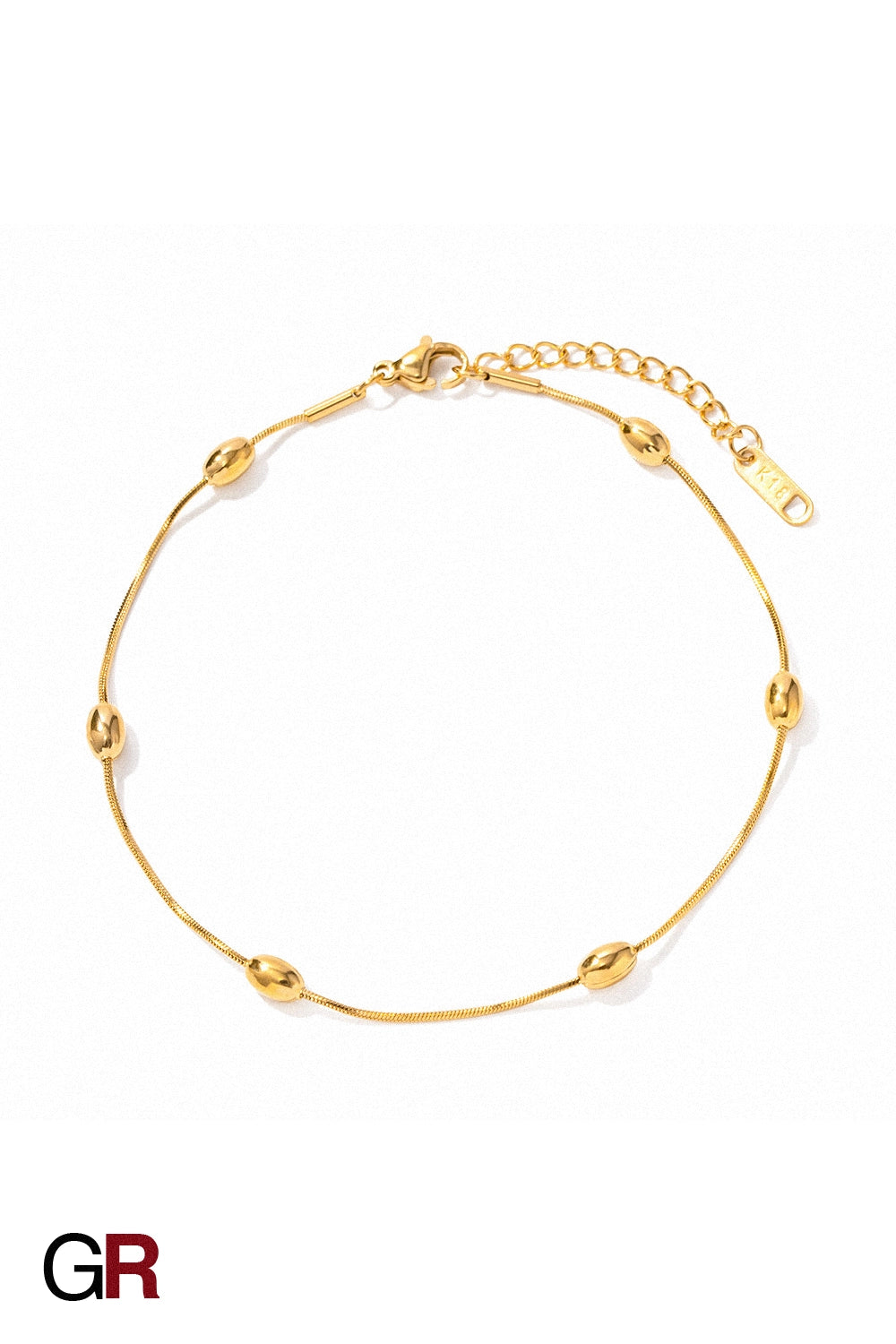 “GlamoROZ Aurora Sol Luminous Beaded Anklet gold-tone chain and bead detail close-up”