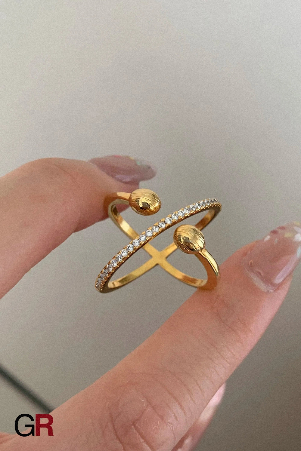 “GlamoROZ Orion Orbit Gold & Silver Chain Ring Jewelry flat-lay on soft beige fabric background”