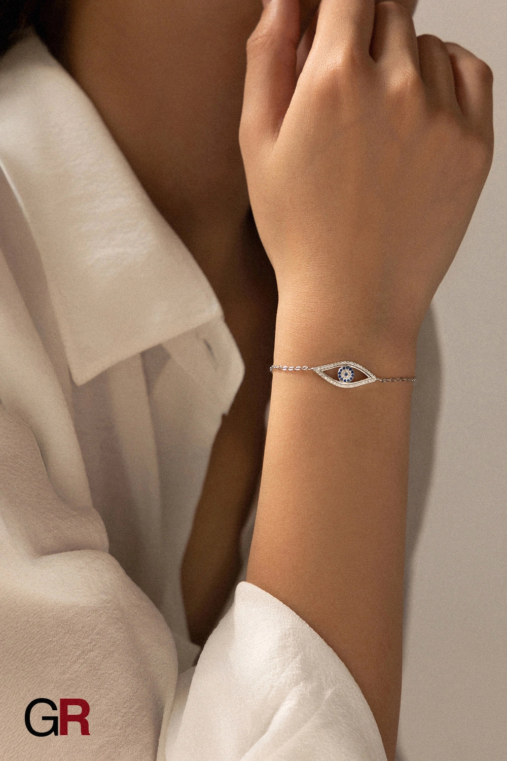 “GlamoROZ Regard Etoile Luminous Silver Eye Charm Bracelet Jewelry front view on neutral background”