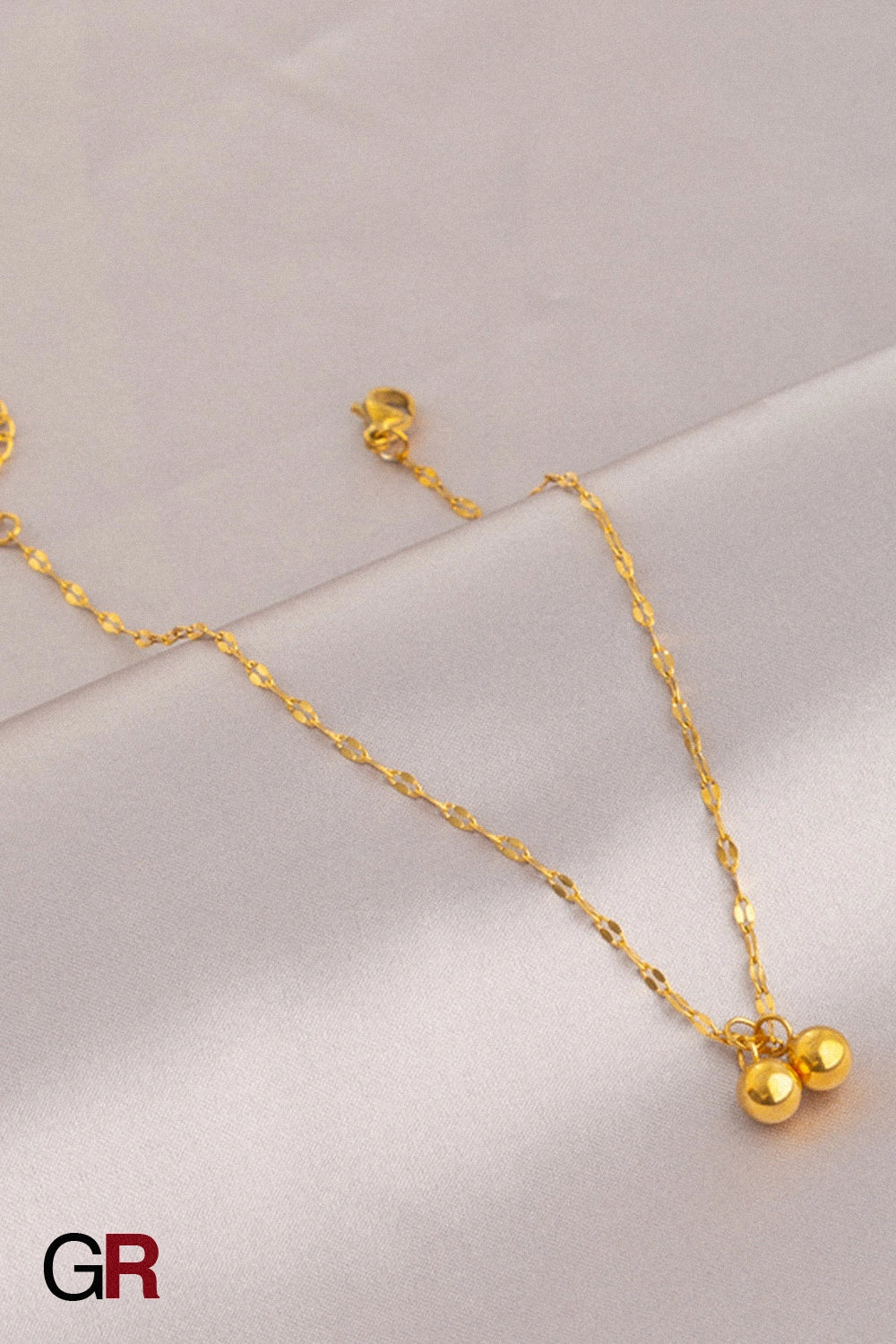 “GlamoROZ Muse Dorée Luminous Gold Beaded Anklet Jewelry styled on model ankle with sandals”