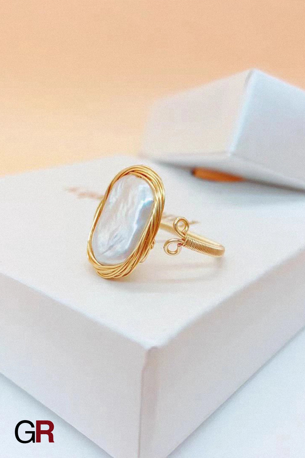 “GlamoROZ Lueur Rose Gold & Steel Index Ring Jewelry styled on model index finger with minimalist outfit”