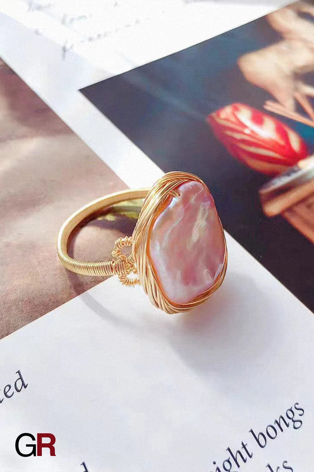 “GlamoROZ Lueur Rose Gold & Steel Index Ring Jewelry front view on neutral background”