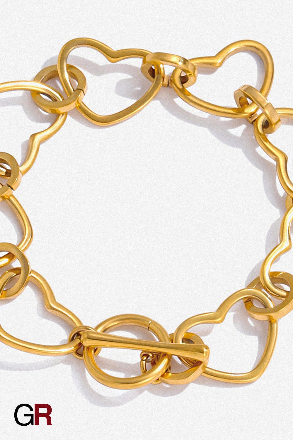 “GlamoROZ Coeur Divin Luminous Gold Charm Bracelet Jewelry gold-plated chain and clasp detail close-up”