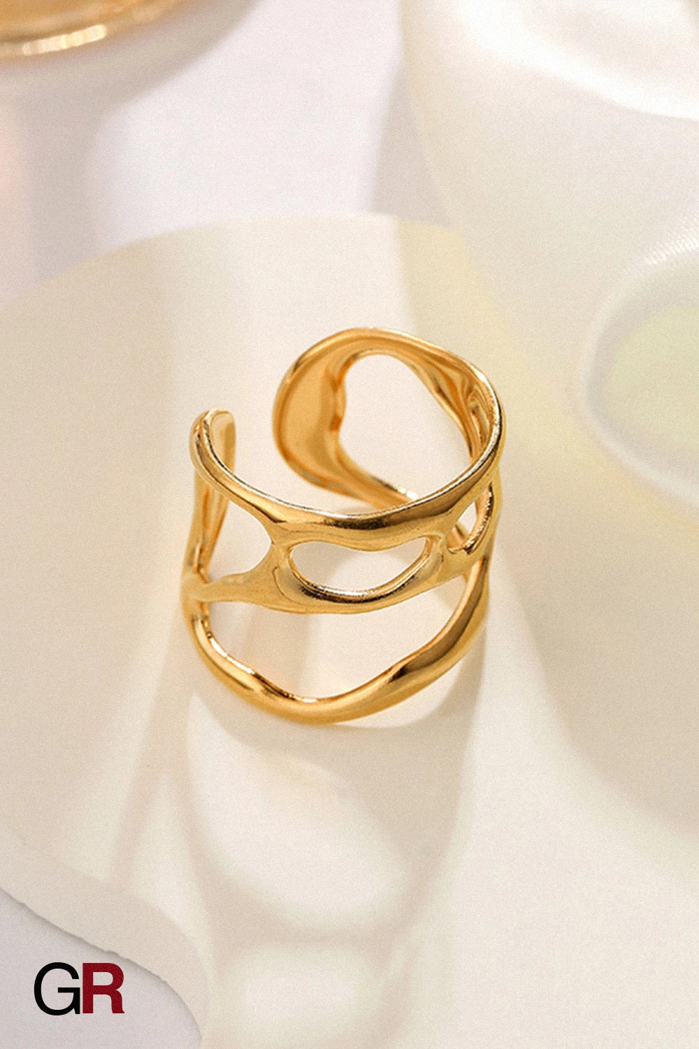 “GlamoROZ Muse Doré Fluid Gold Band Ring Jewelry styled on model hand with elegant outfit”