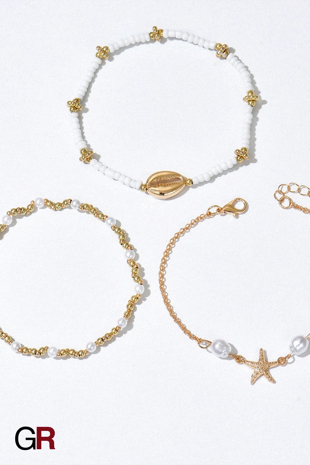 “GlamoROZ Étoile de Mer Layered Anklet Set front view on neutral background”