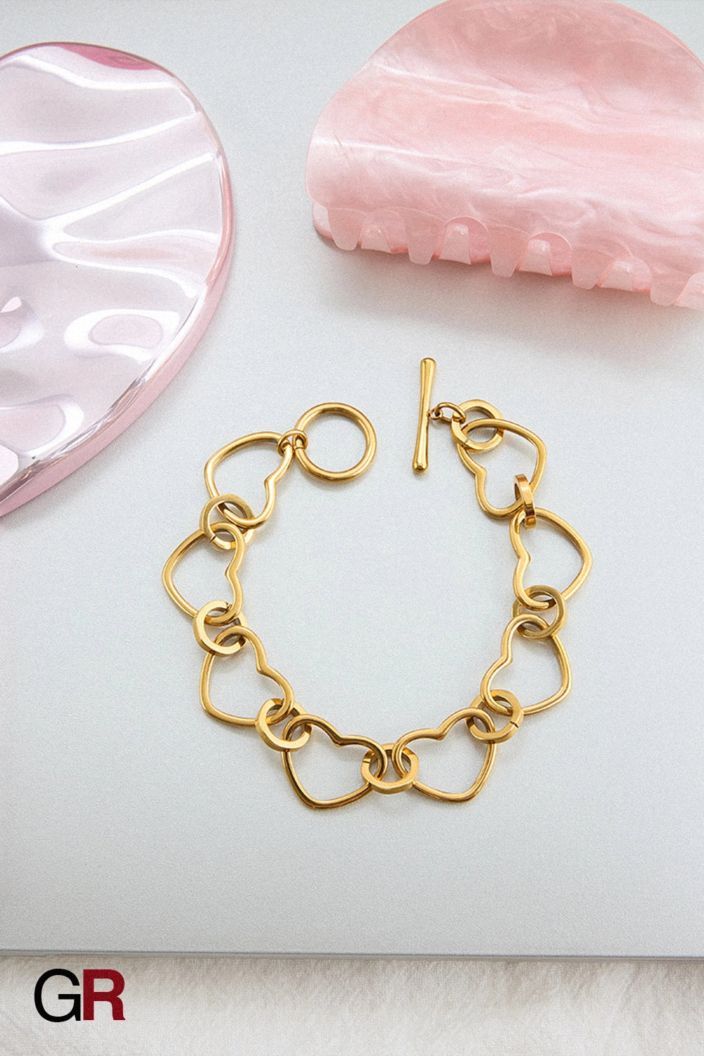 “GlamoROZ Coeur Divin Luminous Gold Charm Bracelet Jewelry close-up of gold heart charms”