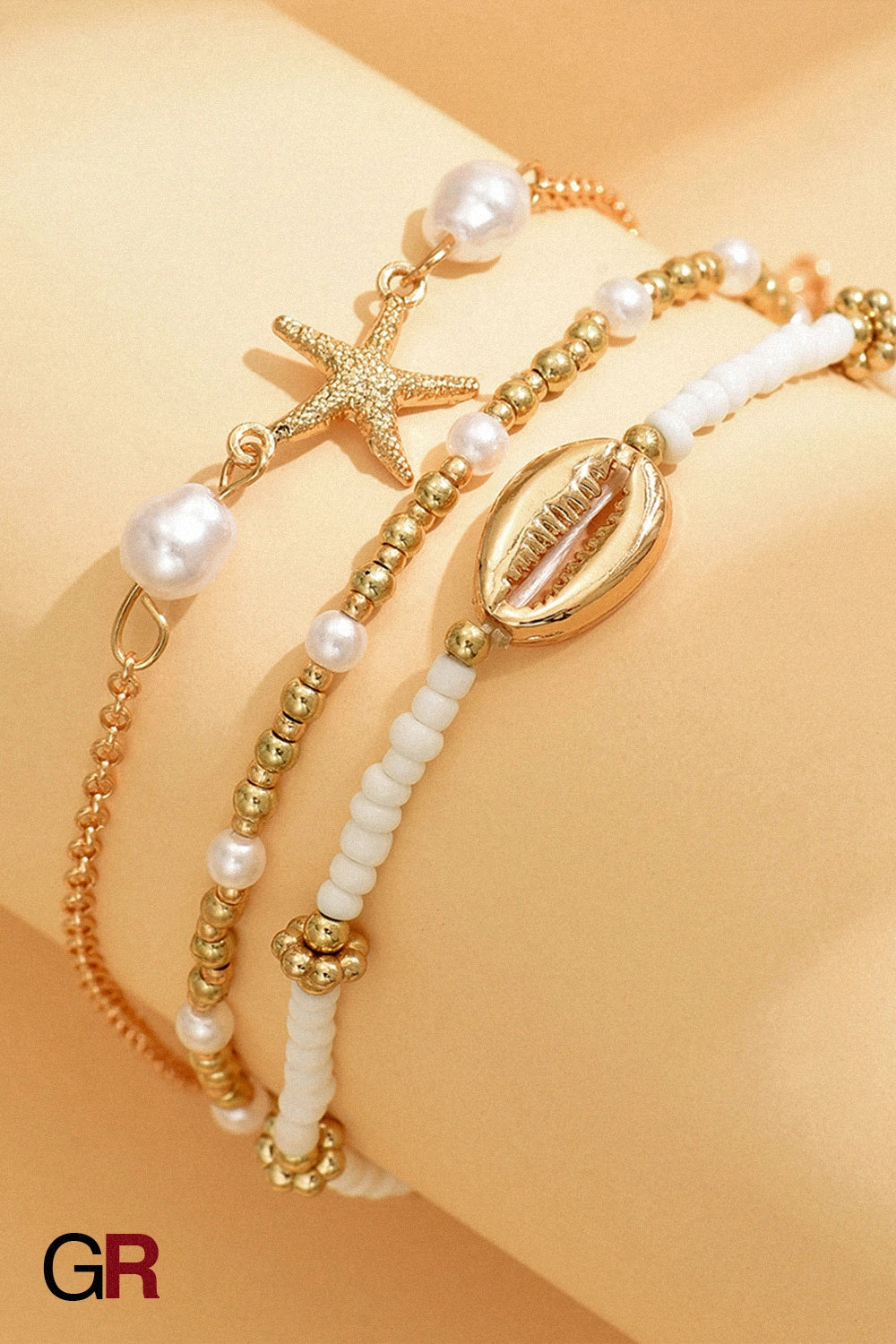 “GlamoROZ Étoile de Mer Layered Anklet Set starfish charm and shell detail close-up”