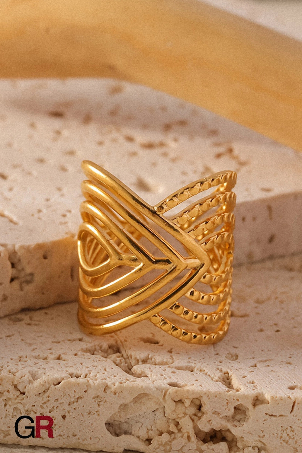 “GlamoROZ Aurum Apex Geometric Ring Jewelry close-up of brushed stainless steel texture”