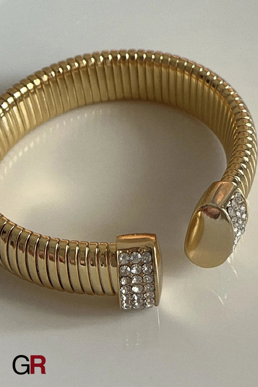 “GlamoROZ Lustre Dore Luminous Gold Wide Rib Cuff Jewelry gold-plated band and open end detail close-up”