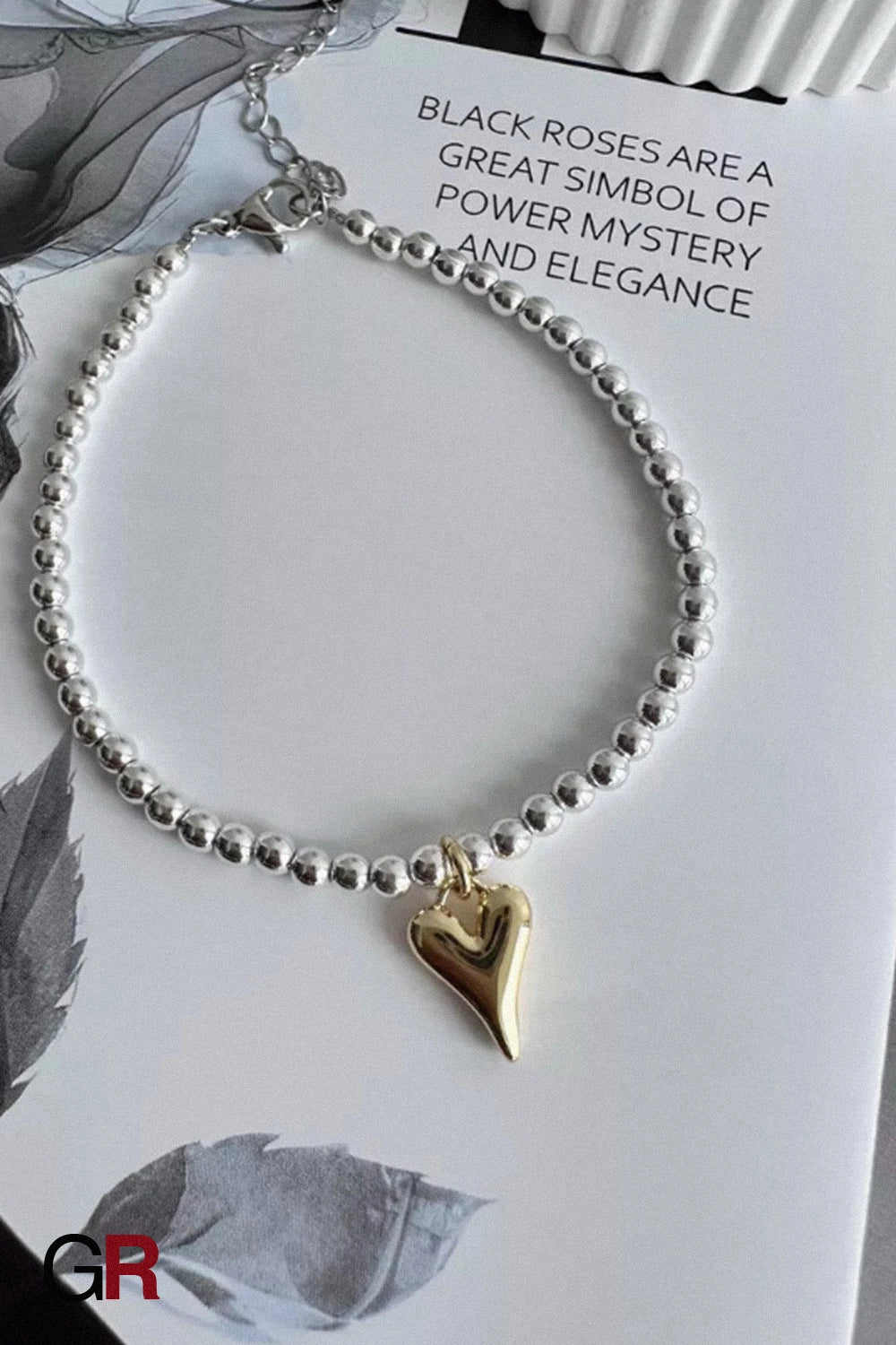 “GlamoROZ Amour Deux Luminous Gold Beaded Bracelet Jewelry styled on model wrist with elegant outfit”