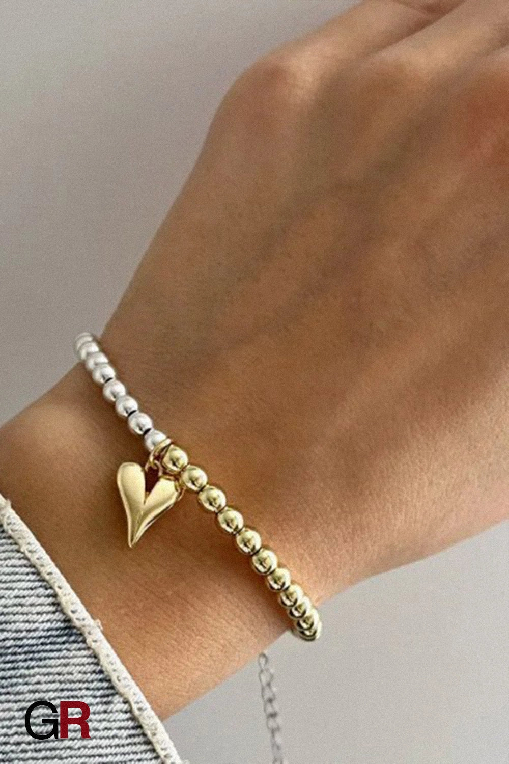 “GlamoROZ Amour Deux Luminous Gold Beaded Bracelet Jewelry detailed macro shot highlighting double-chain design and luminous gold finish”