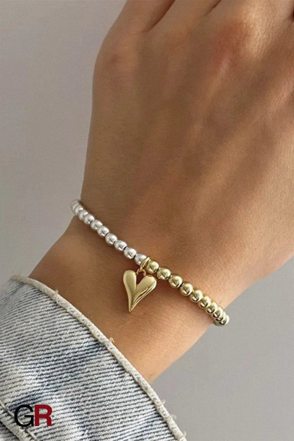 “GlamoROZ Amour Deux Luminous Gold Beaded Bracelet Jewelry front view on neutral background”