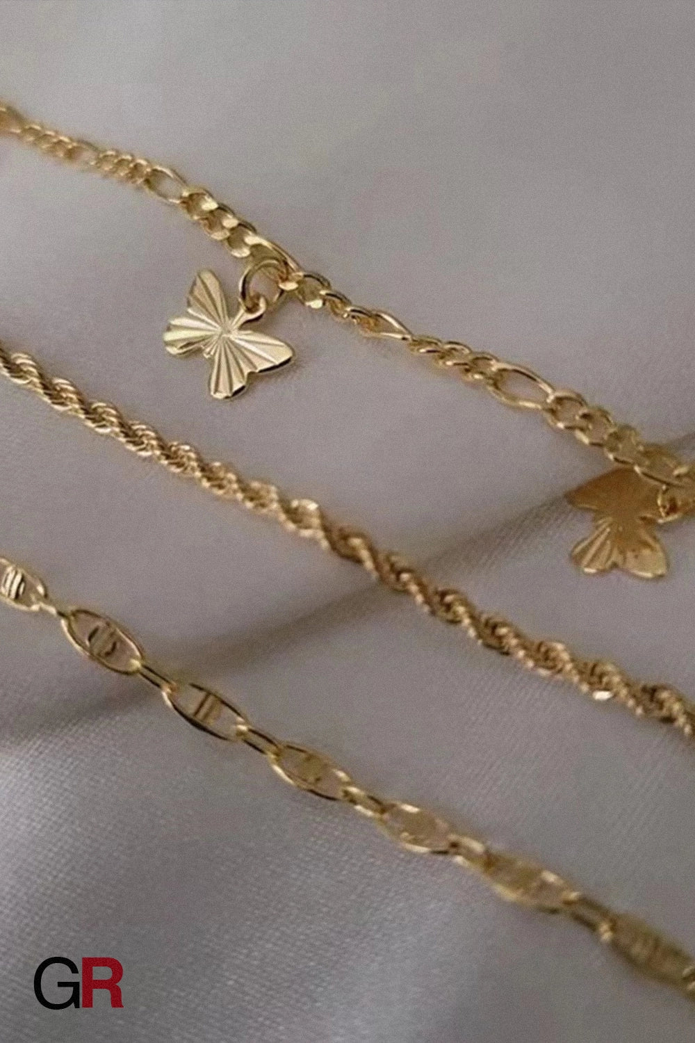 “GlamoROZ Jardin Papillon Golden Anklet Set front view on neutral background”