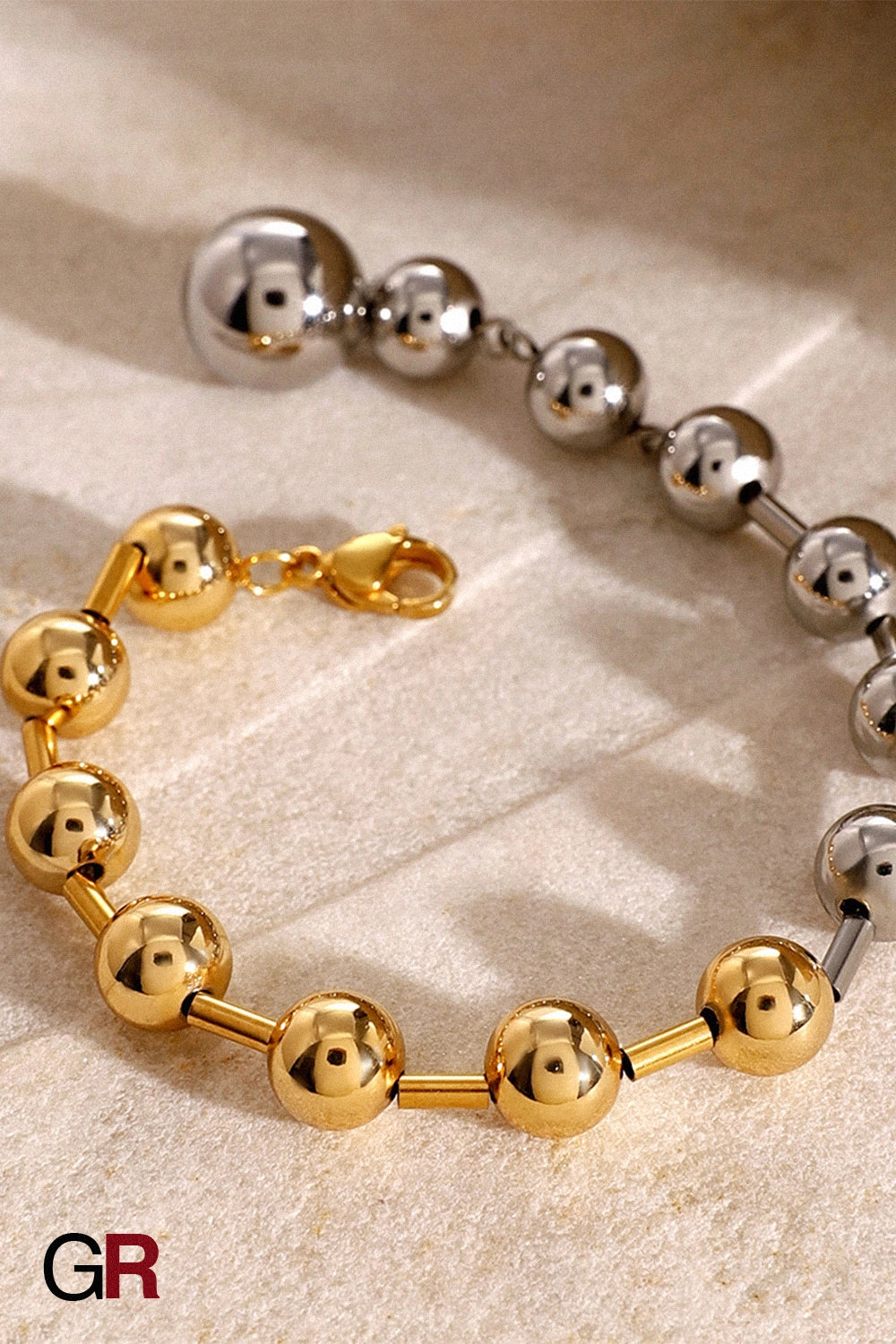 “GlamoROZ Éclat Doré Luminous Gold Bead Bracelet Jewelry front view on neutral background”