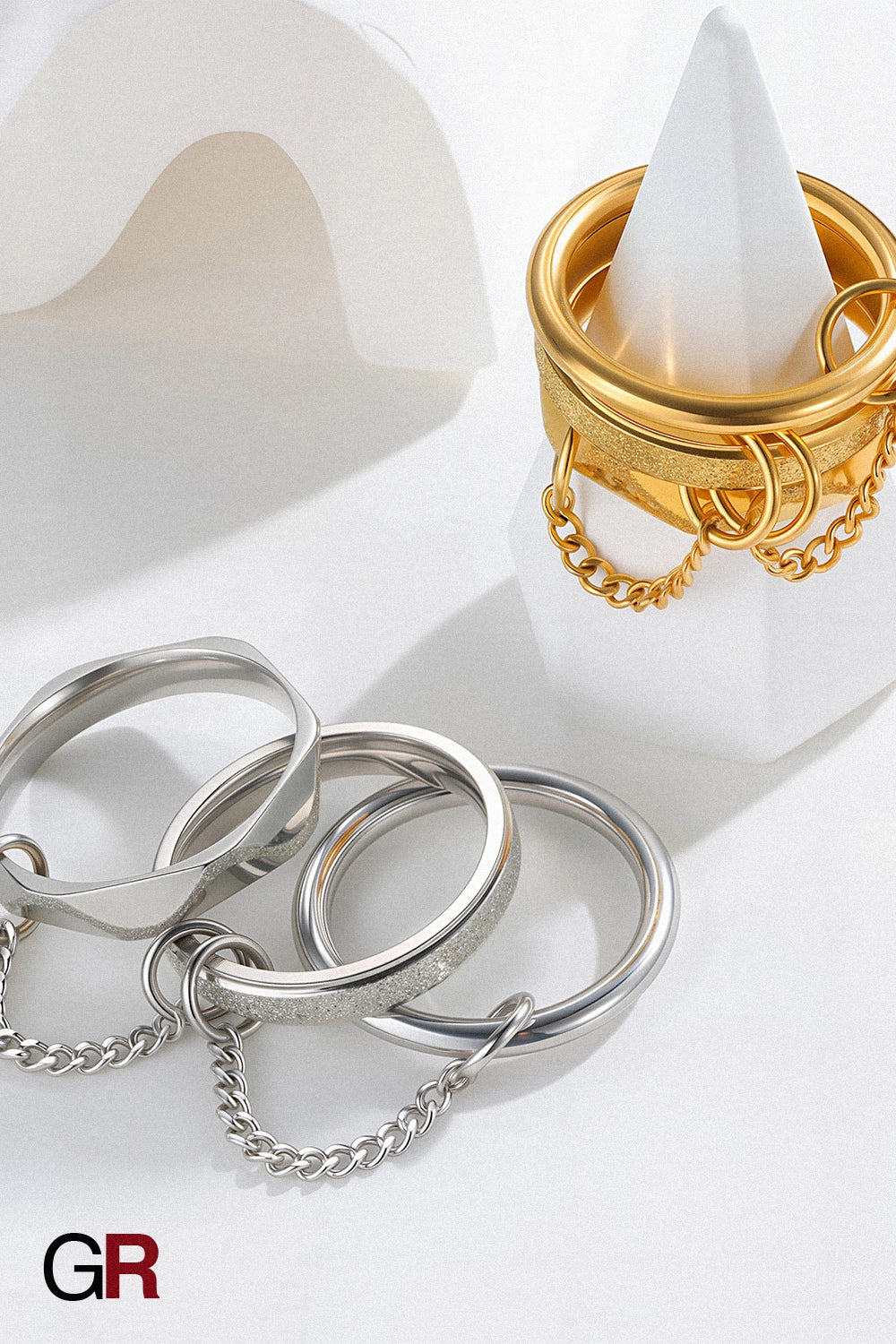 “GlamoROZ Orbit Eclipse Gold & Silver Chain Ring Set Jewelry front view on neutral background”